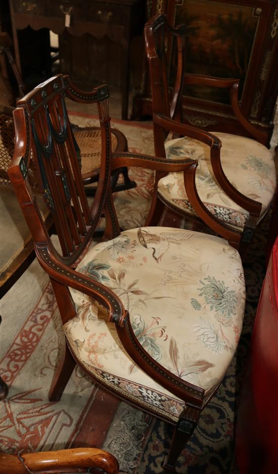 A pair of Edwardian Hepplewhire design mahogany and painted and decorated shield back elbow chairs